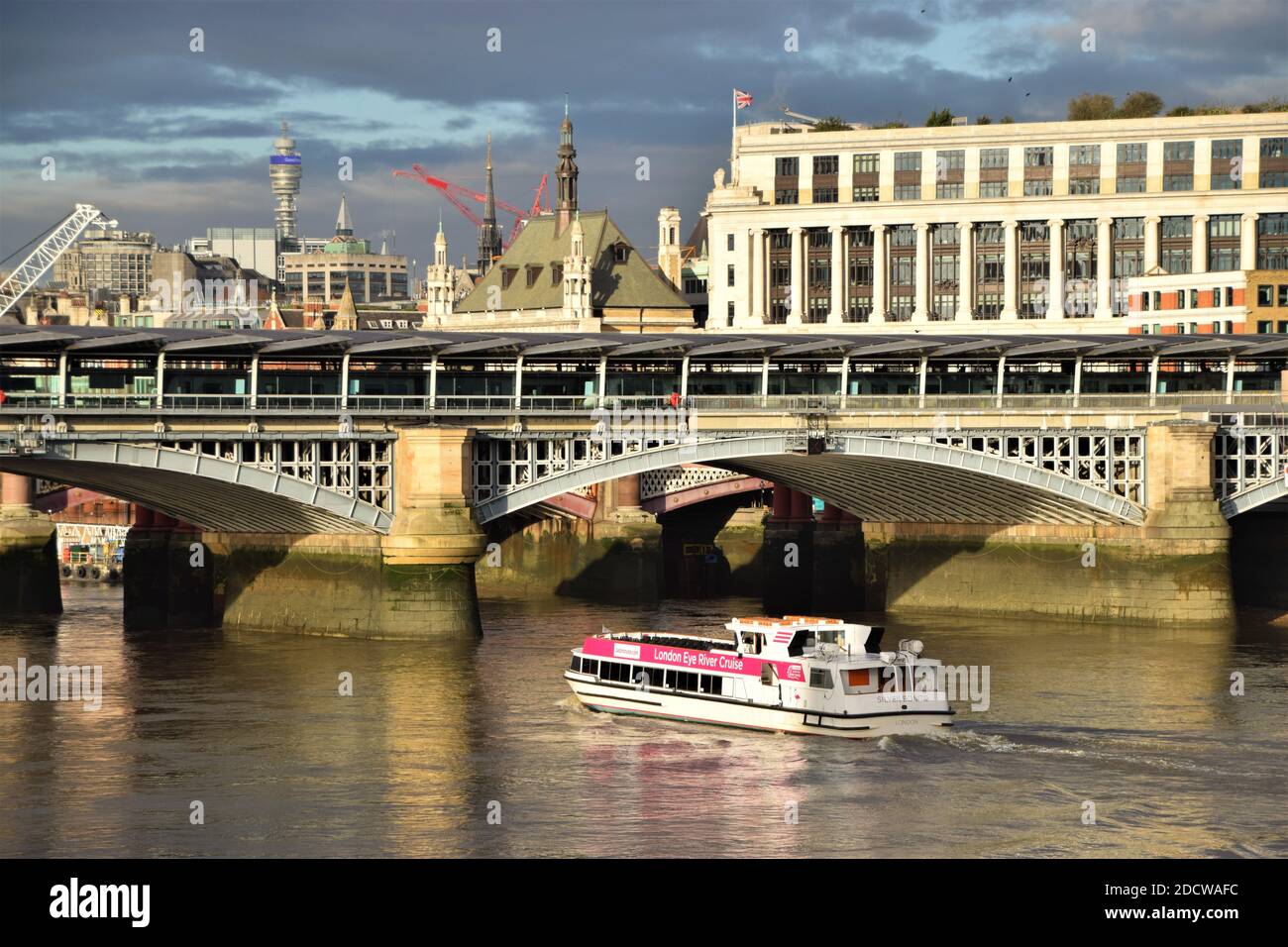 Blackfriars Bridge and Thames cruise boat, London, United Kingdom Stock Photo