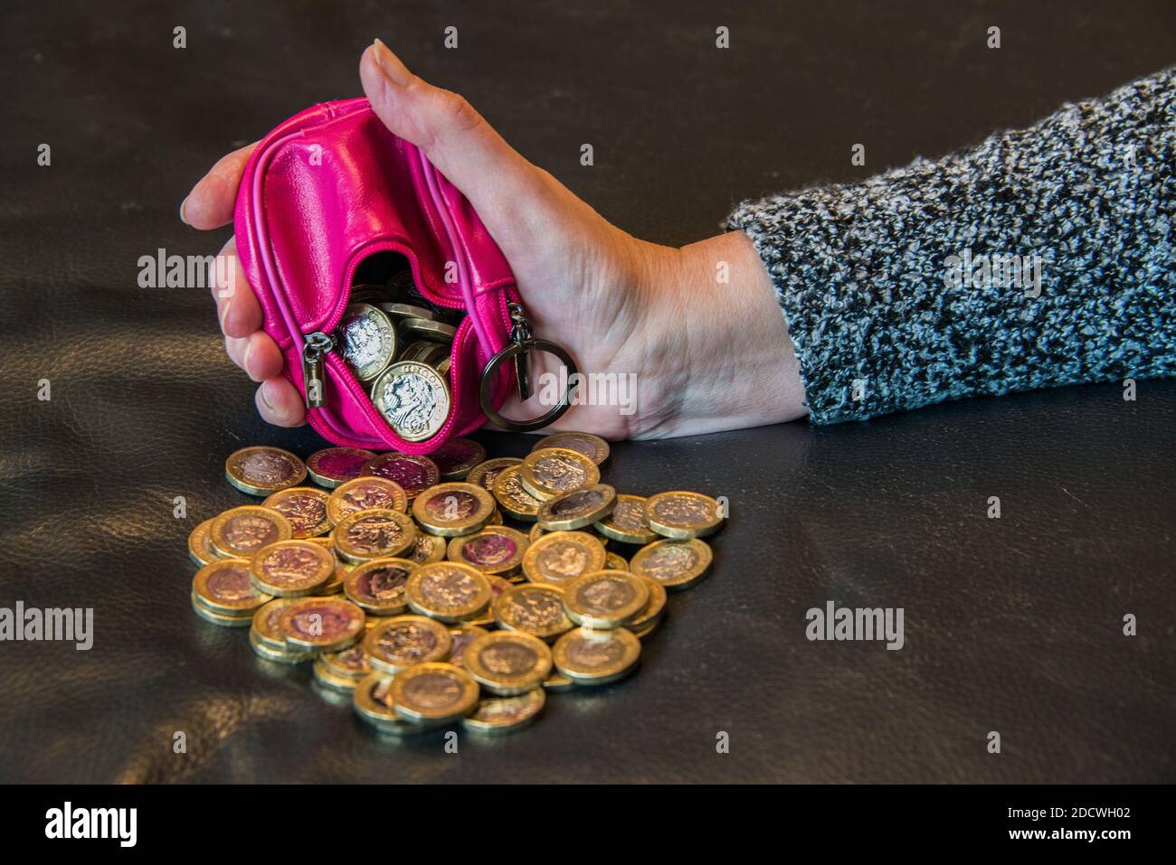A purse full of £1 coins. Stock Photo