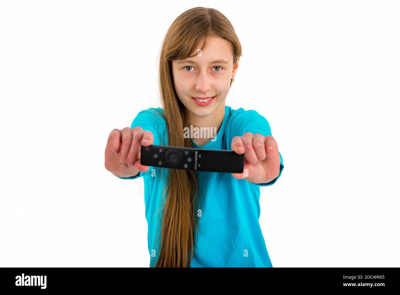 Girl kid child holds tv remote control.White studio wall.Closeup Stock ...