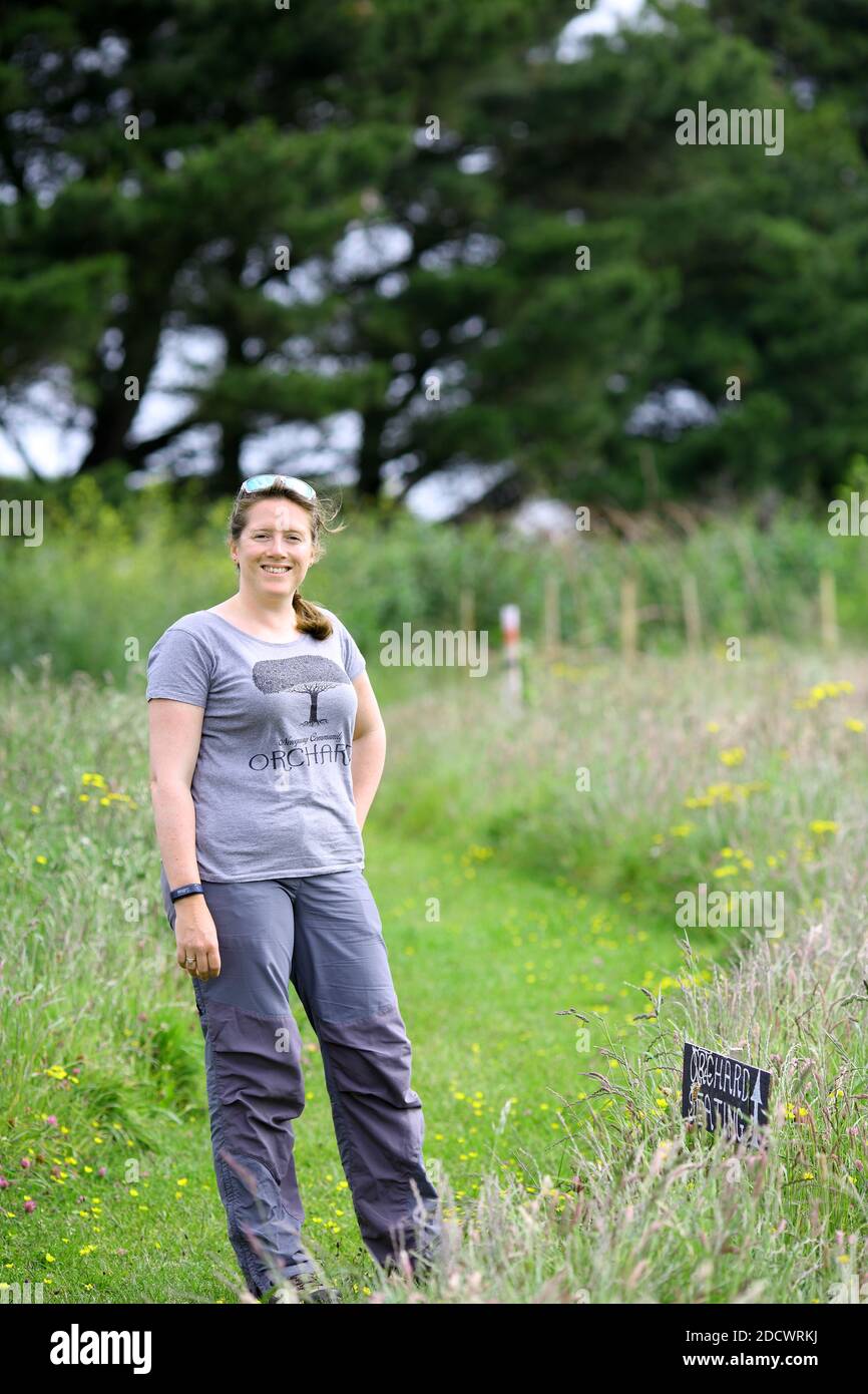 Happy woman at the Newquay Community Orchard Newquay , Cornwall, England Stock Photo