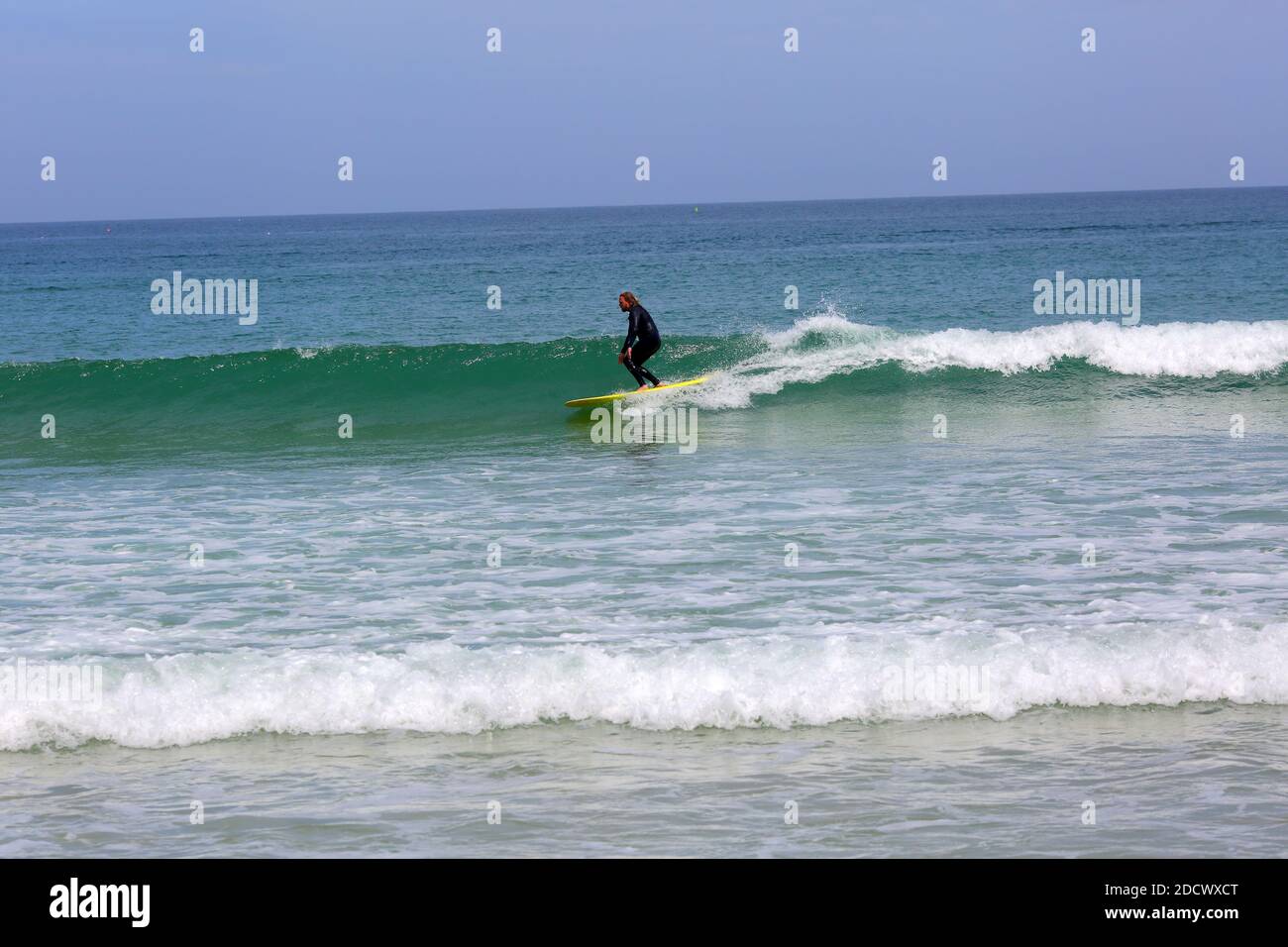 Surfer surfing at at Great Western Beach in Newquay , Cornwall, England Stock Photo