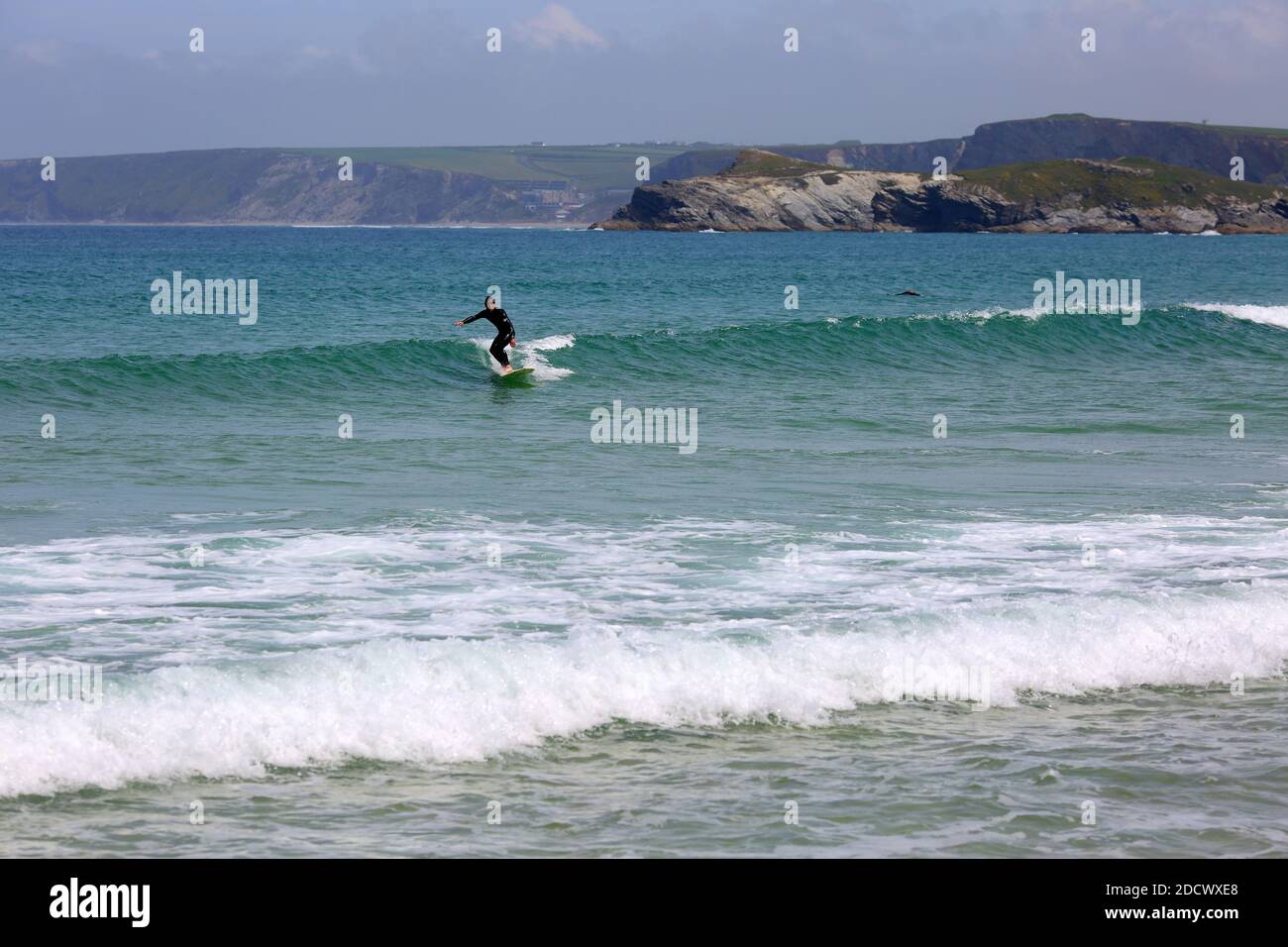 Surfer surfing at at Great Western Beach in Newquay , Cornwall, England Stock Photo