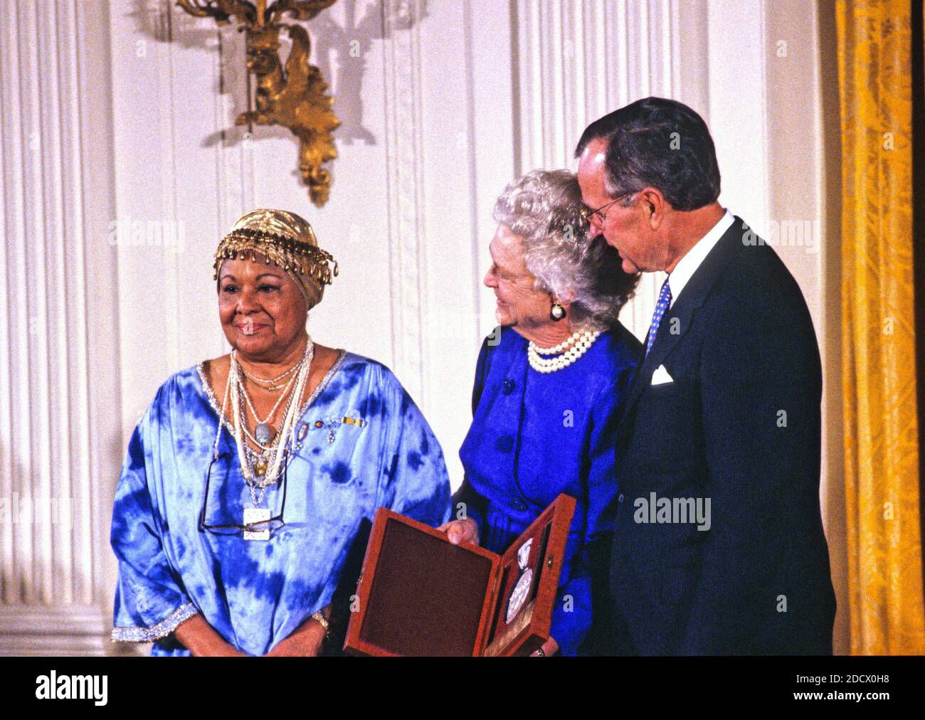 United States President George H.W. Bush and first lady Barbara Bush present the National Medal of Arts to American dancer and choreographer Katherine Dunham during a ceremony in the East Room of the White House in Washington, DC on November 19, 1989. Credit: Ron Sachs / CNP/ABACAPRESS.COM Stock Photo