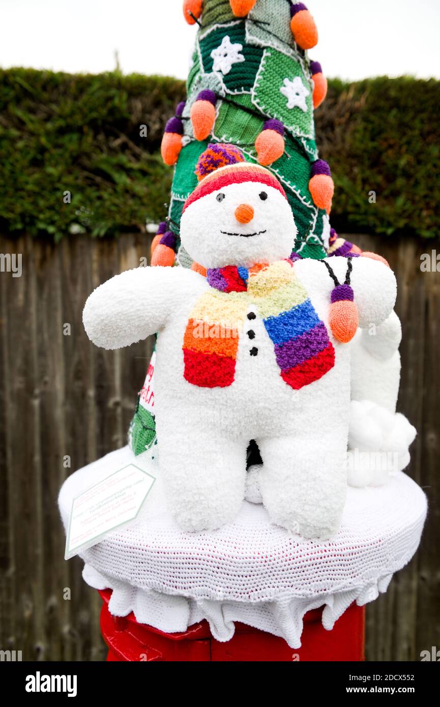 Hertford, UK. 23rd November 2020. Knitters in Hertford, UK, have been 'yarn bombing' various different post boxes with different designs for the tops of post boxes. The post boxes have been given various Christmas designs to the tops. These were created by the SSOHC. Andrew Steven Graham/Alamy Live News Stock Photo