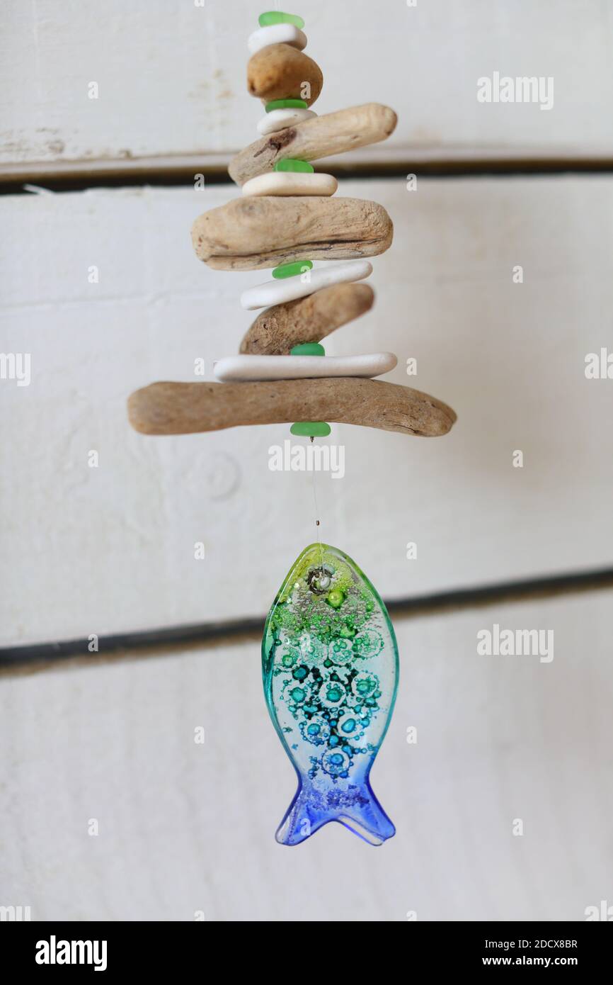 Hanging driftwood and glass fish mobile Stock Photo Alamy