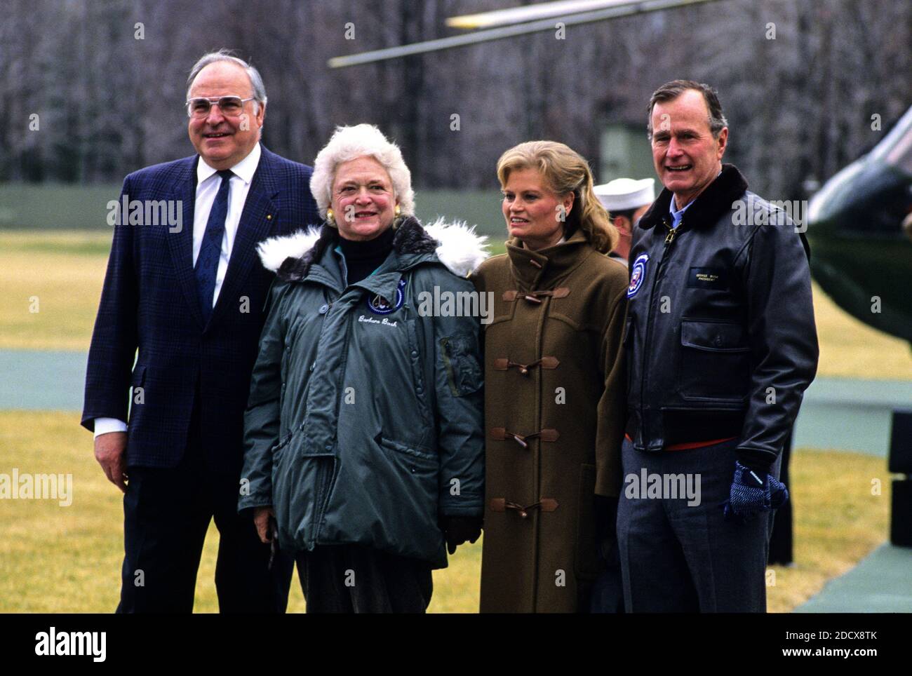 United States President George H.W. Bush, right, and first lady Barbara Bush, left center, welcome Chancellor Helmut Kohl of West Germany, left, and his wife, Hannelore, right center, to Camp David, the presidential retreat near Thurmont, Maryland on February 24, 1990. Photo by Ron Sachs/CNP/ABACAPRESS.COM Stock Photo