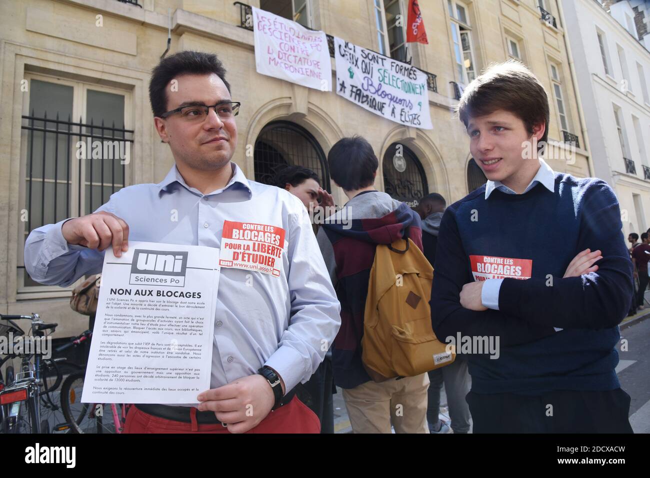 Students from right-wing party object to closure of the entrance of Sciences Po university on April 18, 2018 in Paris, as part of nation-wide demonstrations against higher education reforms, introduced by the French government that give public universities the power to set admission criteria and rank applicants. Placards, suspended from balconies of Sciences Po university, read 'Sciences Po's students against Macron's dictatorship', 'Here are trained those who select. Blocking the elite factory.' 'Macron your school is blocked'. Photo by Alain Apaydin/ABACAPRESS.COM Stock Photo