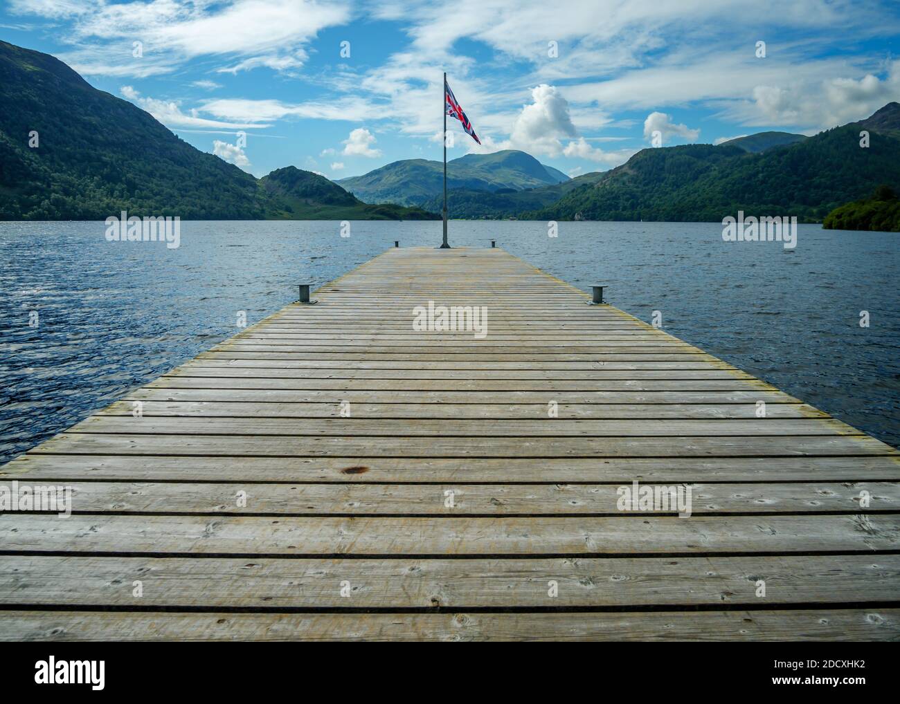 Beautiful view from a pier on Ullswater in the Lake District National Park, UK on a bright summers day. Stock Photo