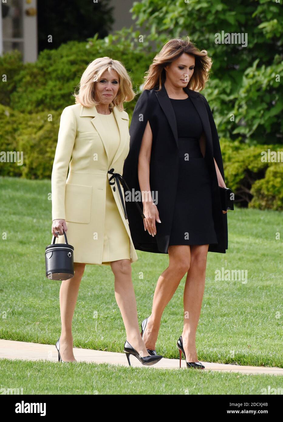 U.S. First Lady Melania Trump and French First Lady Brigitte Macron walk on the South Lawn of the White House, April 23, 2018 in Washington D.C . Photo by Olivier Douliery/ABACAPPRESS.COM Stock Photo