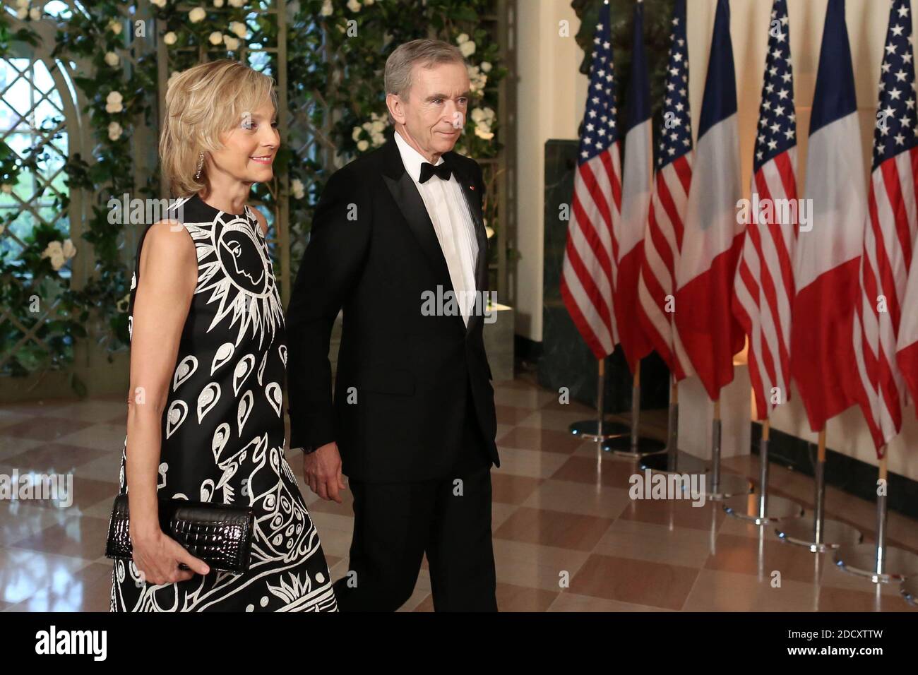 Bernard Arnault and Hélène Arnault arrives in the “Booksellers Area” of the  White House to attend a state dinner honoring France's President Emmanuel  Macron on April 24, 2018 in Washington, DC. Photo