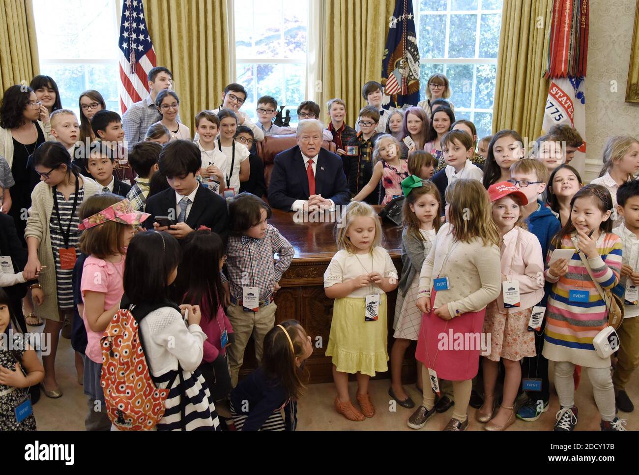 U.S. President Donald Trump meets with children of journalists and