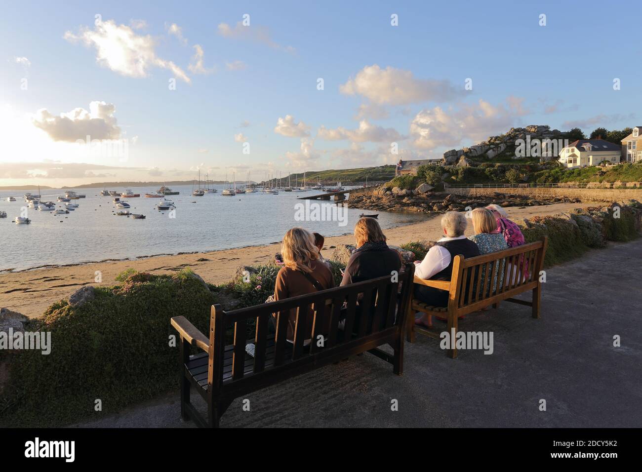 Tourist enjoy the sunset in Hugh Town , St Mary s, Isles of Scilly, England. Stock Photo