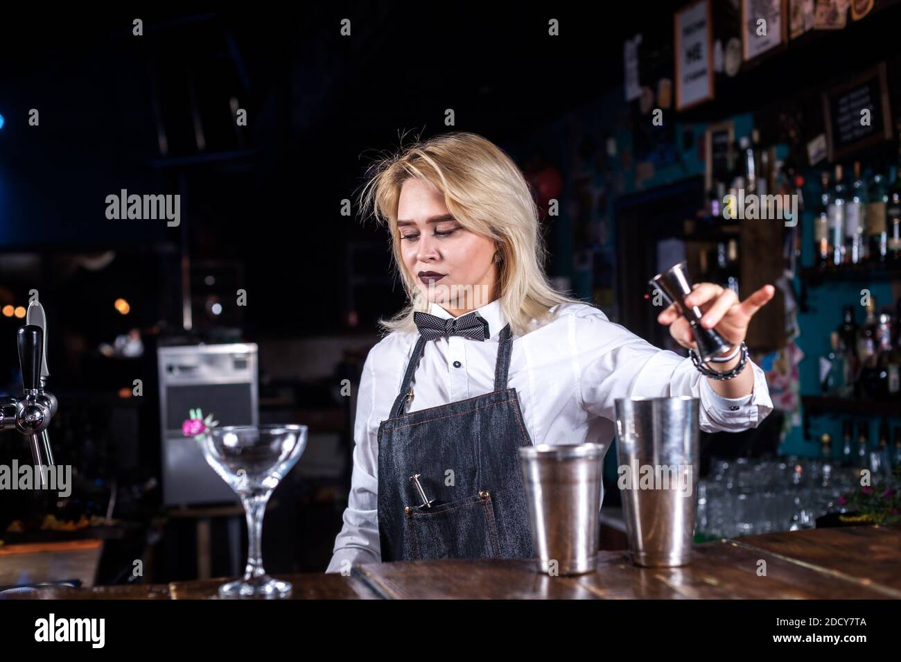 Girl bartender creates a cocktail in the taproom Stock Photo Alamy