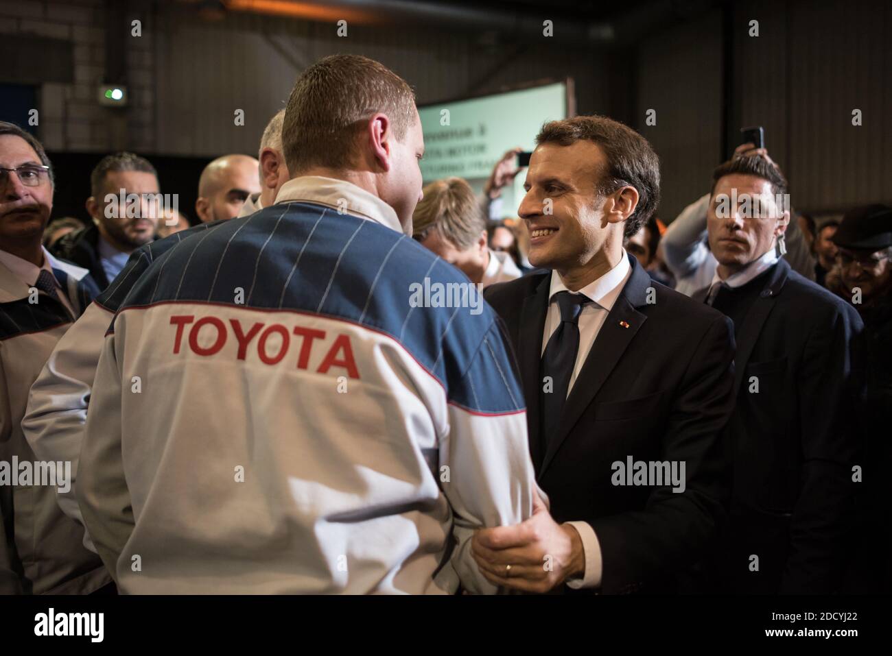 French President Emmanuel Macron visits the Toyota automobile manufacturing plant with Director