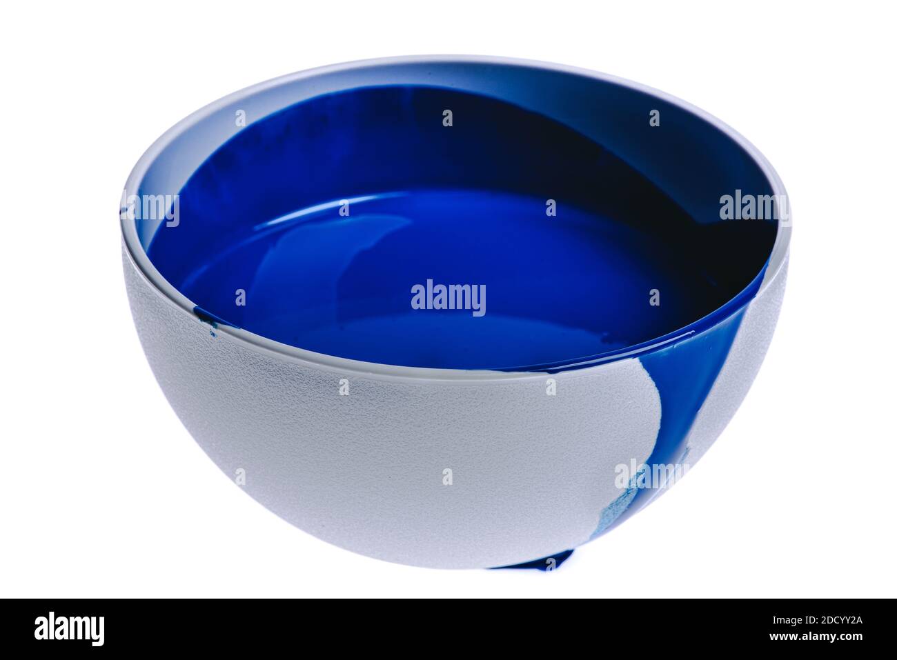 Bowl of blue paint isolated on white background Stock Photo - Alamy