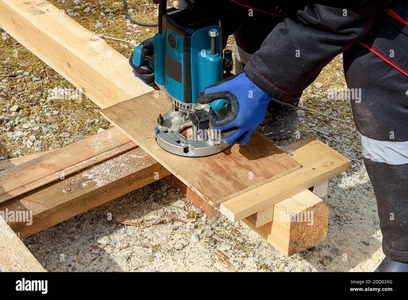 The process of milling wood with a circular machine. Passion for wood carving. Golden hand. Stock Photo