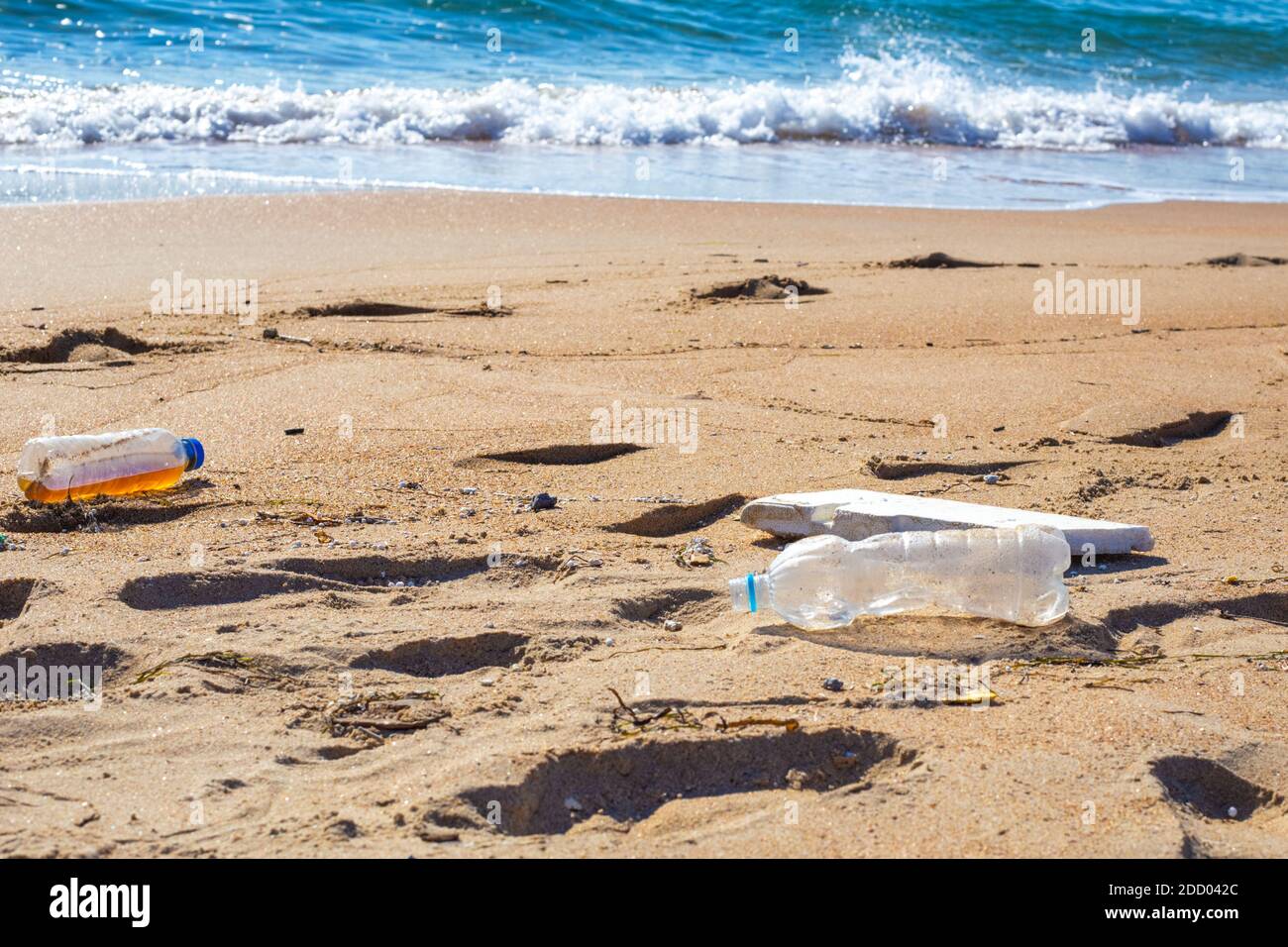 plastic trash on the seashore. Environmental pollution. Ecological catastrophy. Stock Photo
