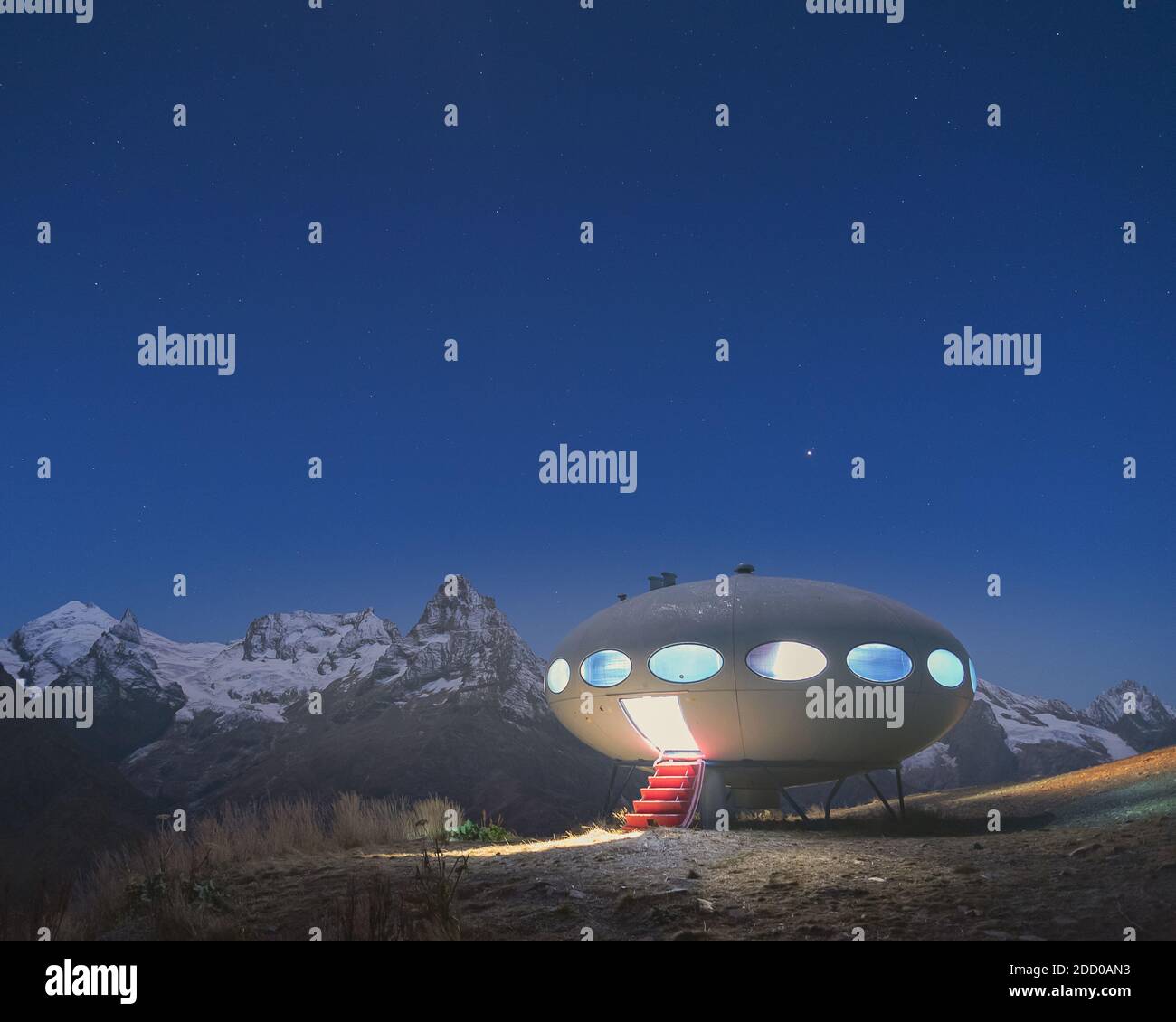 Dombay, Russia, October 10, 2020. Mini-hotel in the form of a UFO flying saucer in the mountains at night Stock Photo