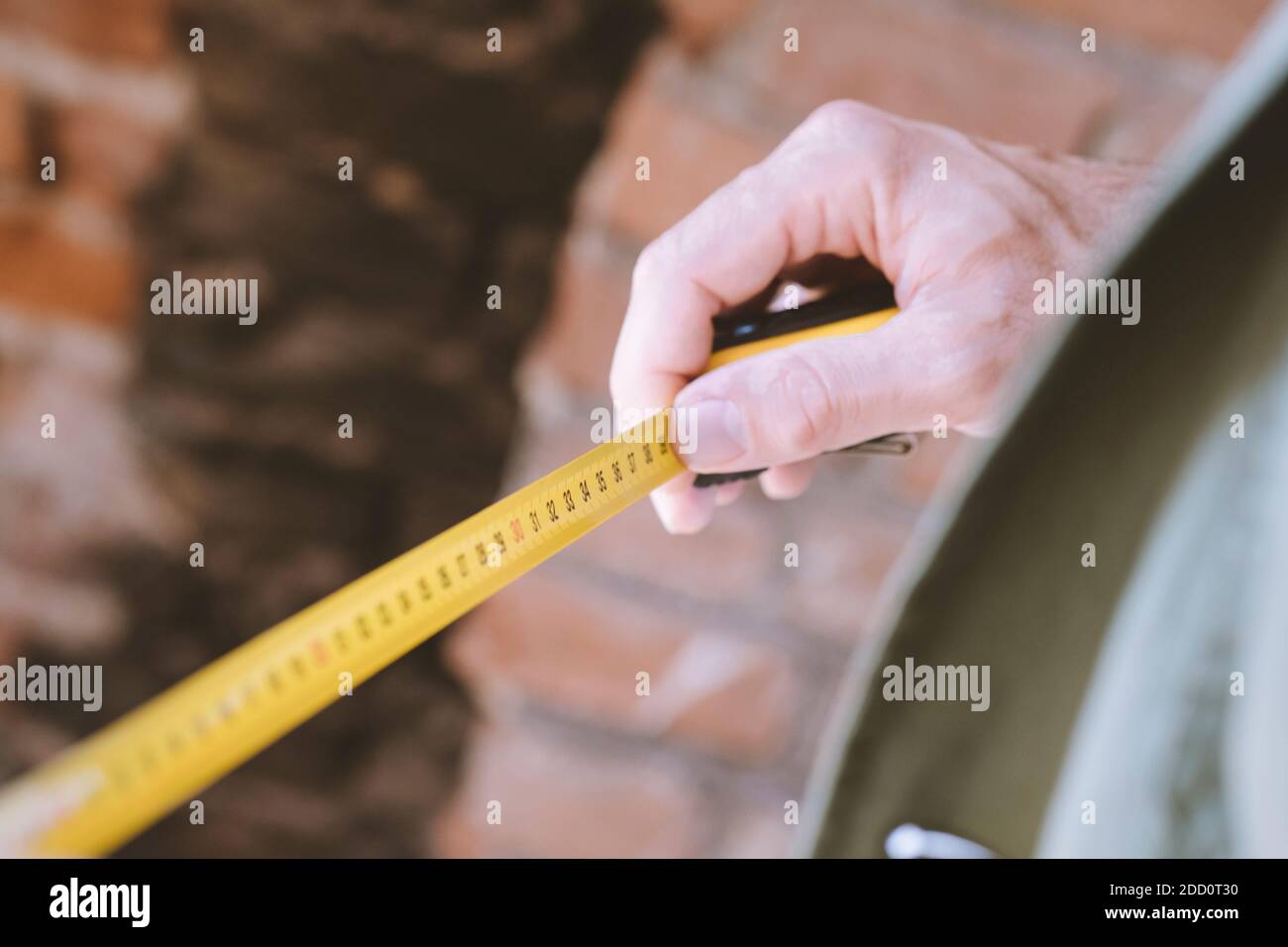 an architect with the yellow meter Stock Photo - Alamy