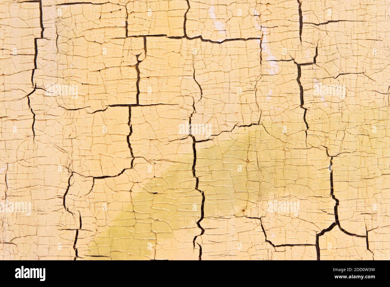 Aged white paint with signs of yellowing and full of cracks from