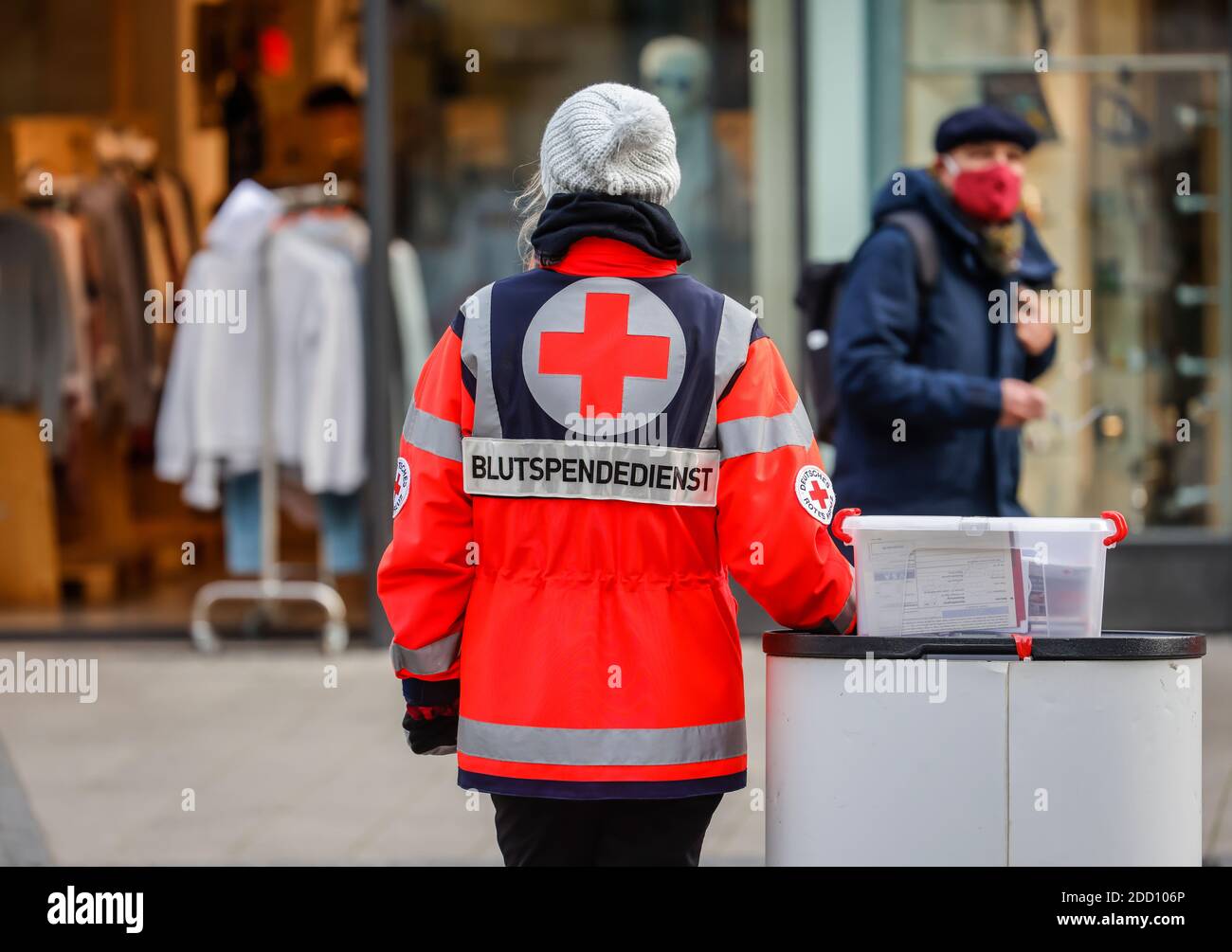 Essen, North Rhine-Westphalia, Germany - Employees of the DRK Blutspendedienst West stand at an information stand in the pedestrian zone and advertise Stock Photo