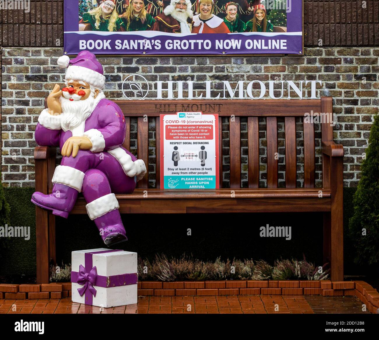 A Santa ornament sits on a bench at Hillmount Garden Centre in Belfast. Stock Photo