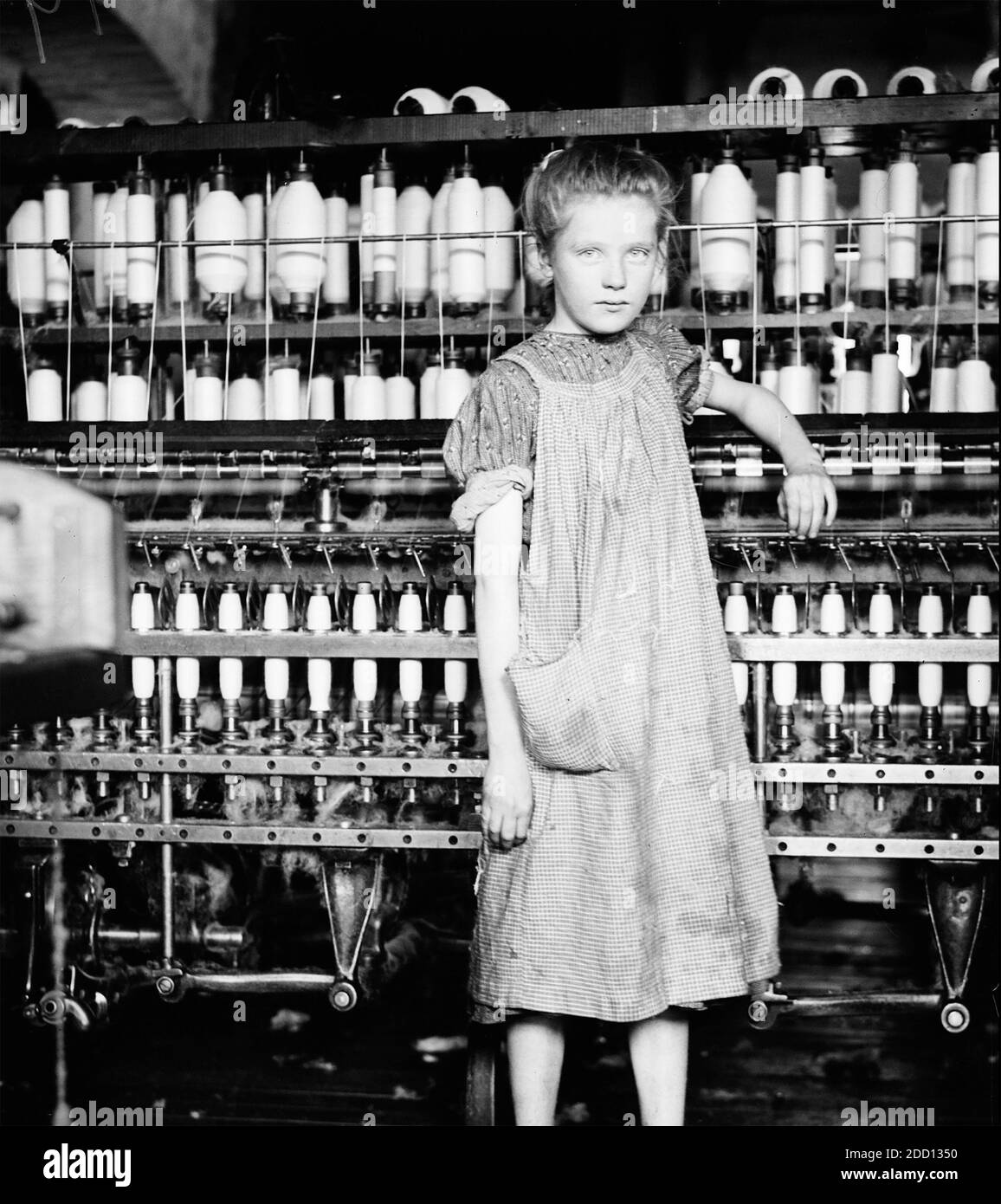 LEWIS HINE (1874-1940) American sociologist and photographer.  His caption reads 'Addie Card, 12 years. Spinner in North Pormal (mispselt Pownal), Cotton Mill,Vt' (Vermont) in 1910. Stock Photo