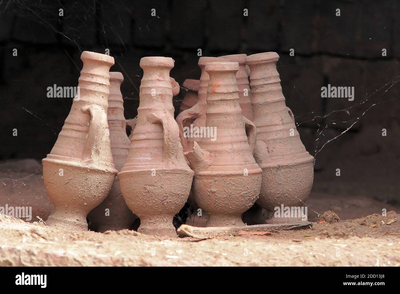 Ancient clay vases pottery in Egyptian sarcophagus covered with cobweb