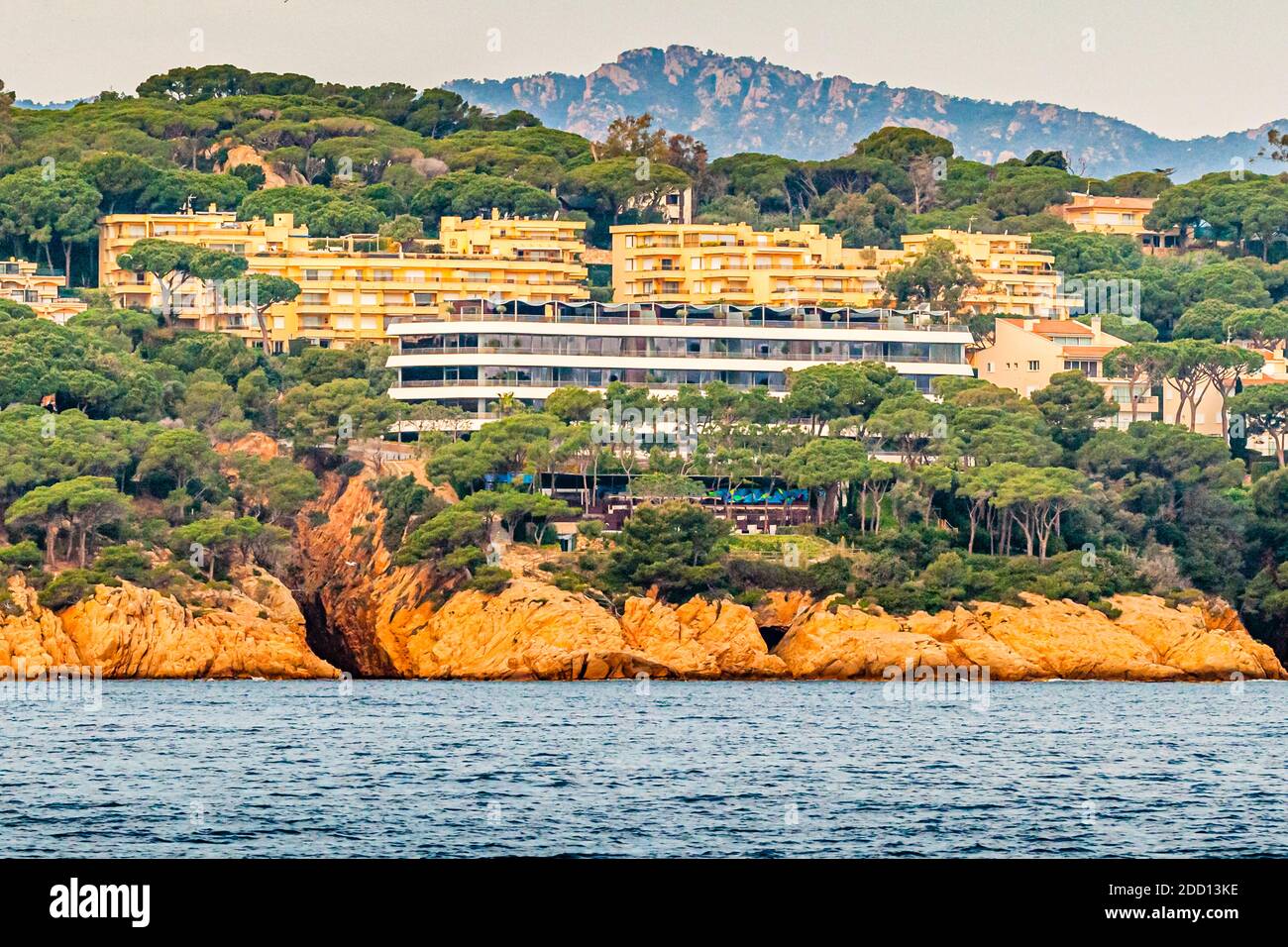 The Alabriga Hotel & Home Suites is anchored like a yacht. The Mediterranean environment lives from the contrast between the green hills of the hinterland and the deep blue of the Mediterranean in Sant Feliu de Guíxols, Spain Stock Photo
