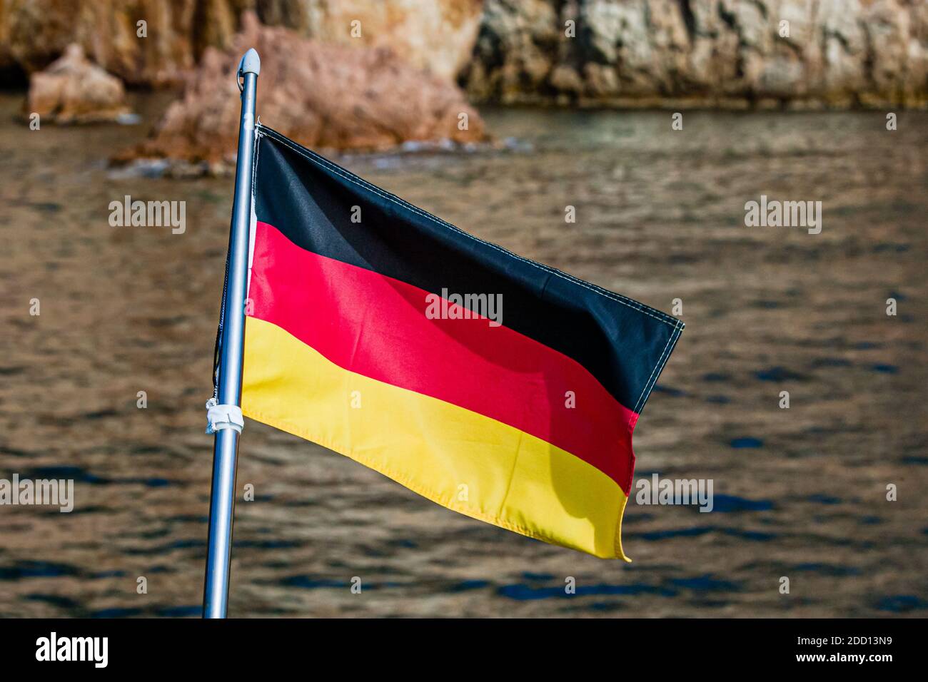 German flag on the stern of a yacht in Sant Feliu de Guíxols, Catalunya,Spain Stock Photo