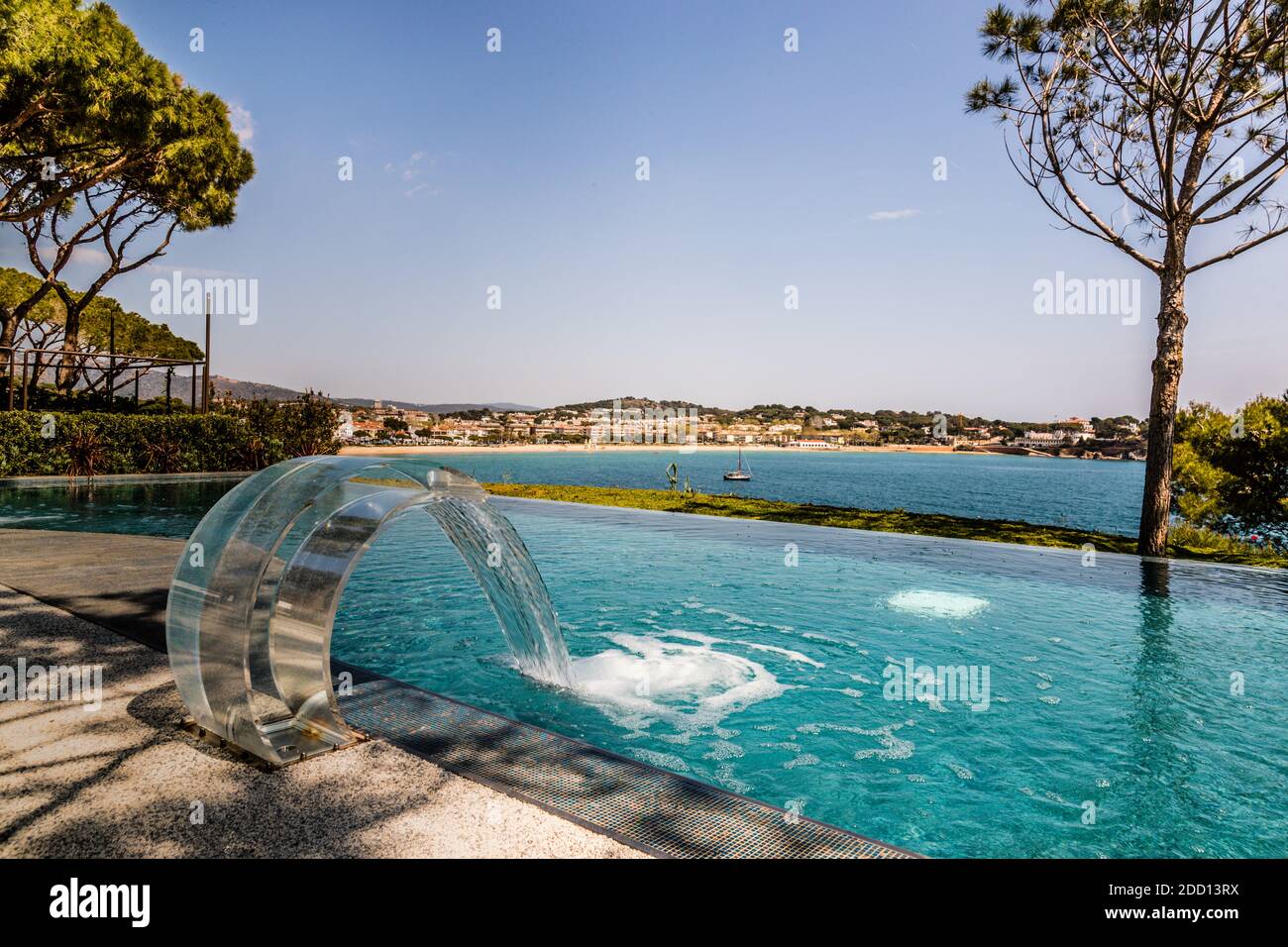 The must-have of every luxury hotel, the infinity pool in the Alàbriga Sea Club with a view of the bay of Sant Feliu de Guìxols, Catalunya, Spain Stock Photo