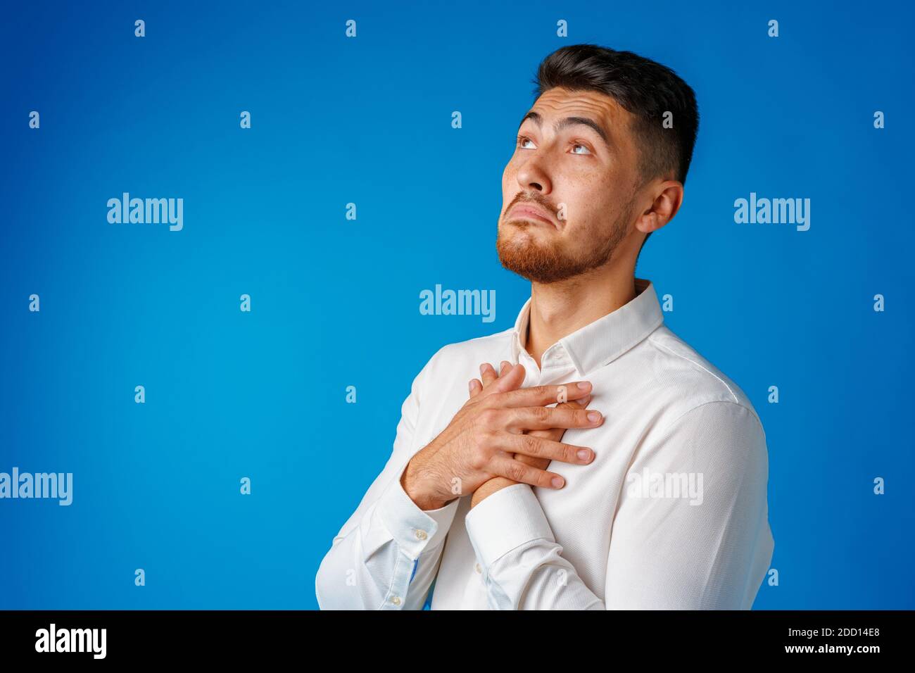 Amazed confused young man hi-res stock photography and images - Alamy