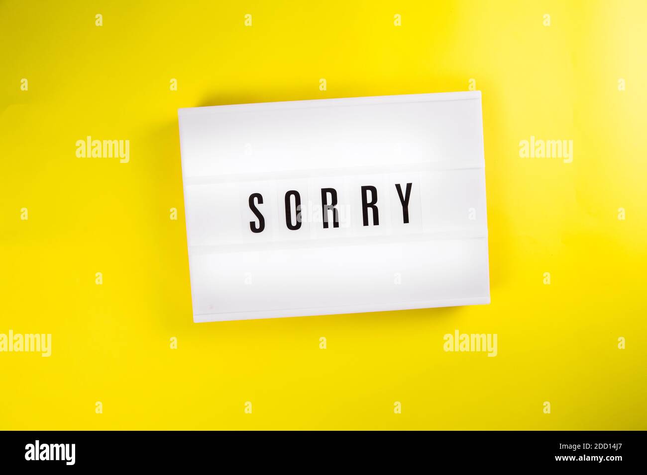 Sorry word on lightbox on yellow background isolated Stock Photo