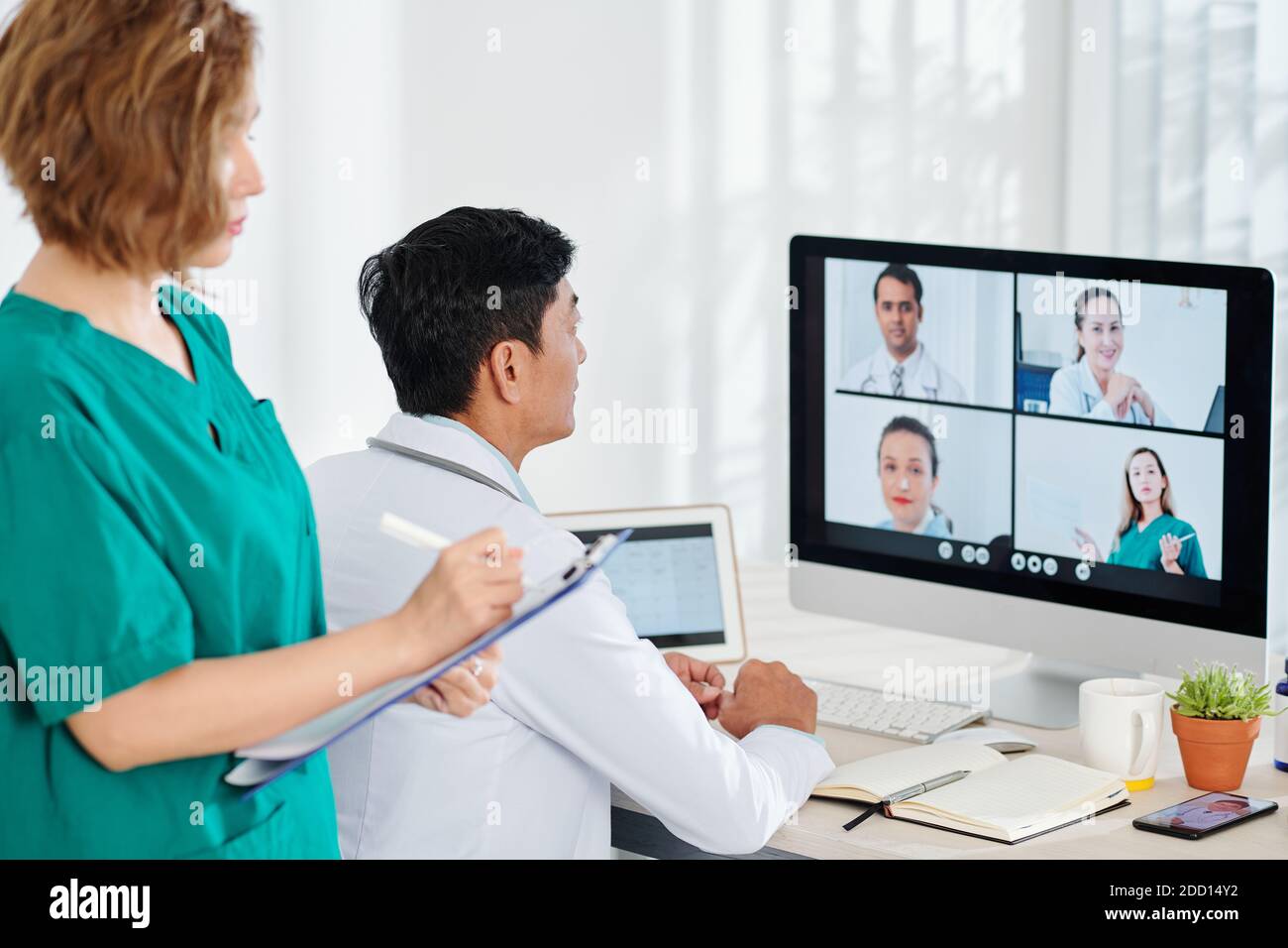 Chief physician having online conference Stock Photo