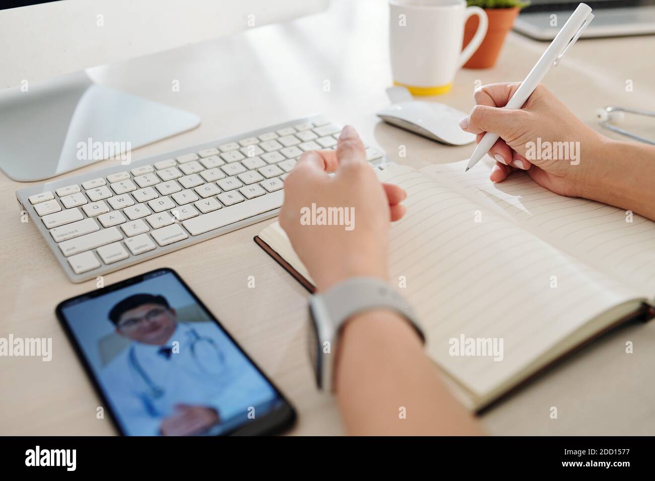 Doctor video calling colleague Stock Photo