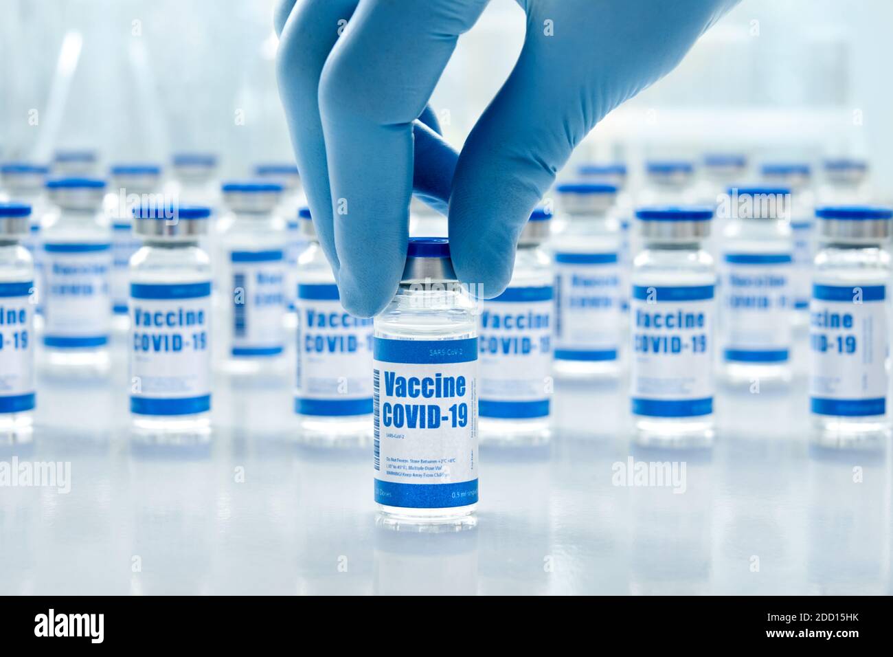 Covid 19 vaccine vial bottles, corona virus cure manufacture concept. Stock Photo