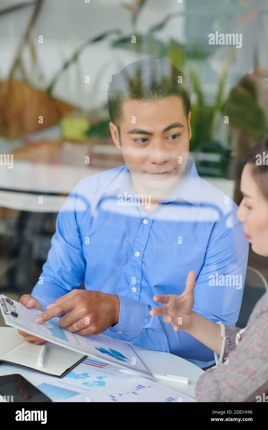 Entrepreneurs discussing report Stock Photo