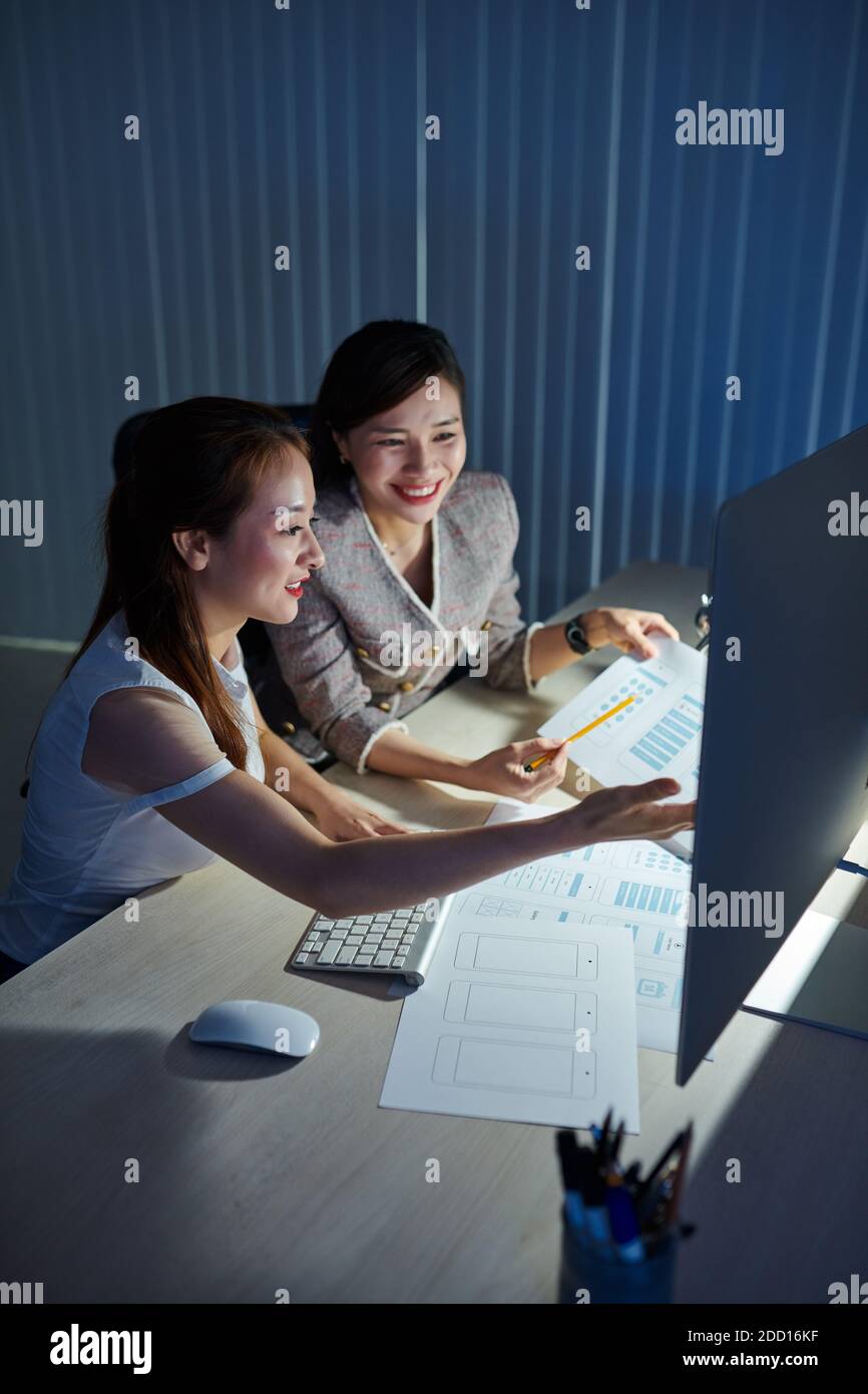 Designers working in dark office Stock Photo