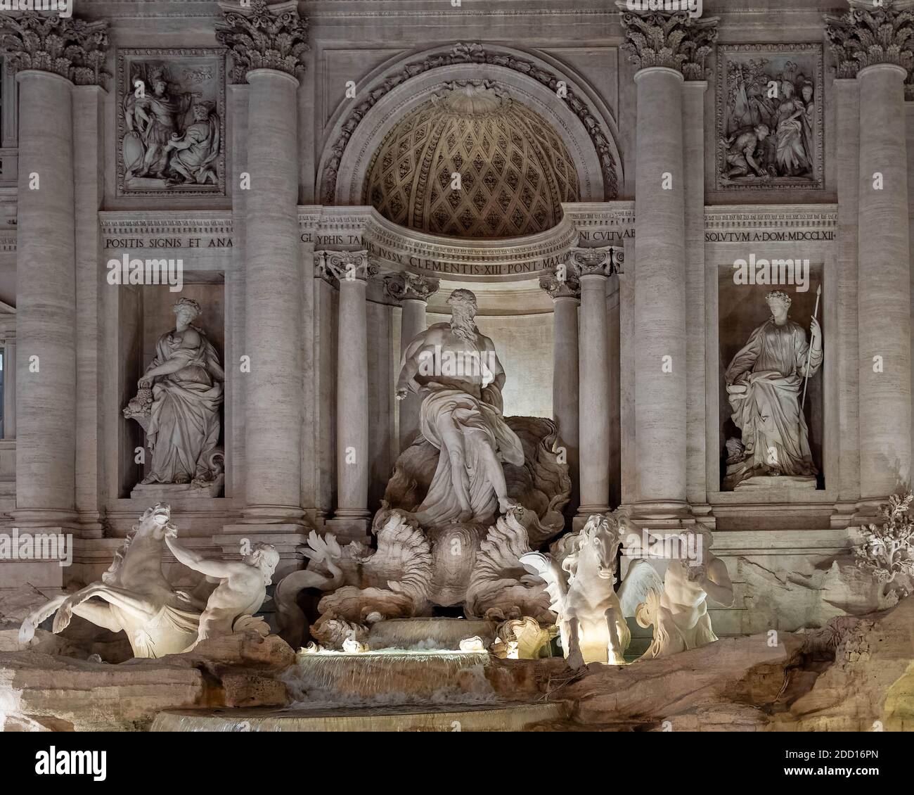 La Dolce Vita. Α partial night view of  the famous Trevi Fountain with impressive illumination.The fountain is in Rome’s Trevi district. Stock Photo
