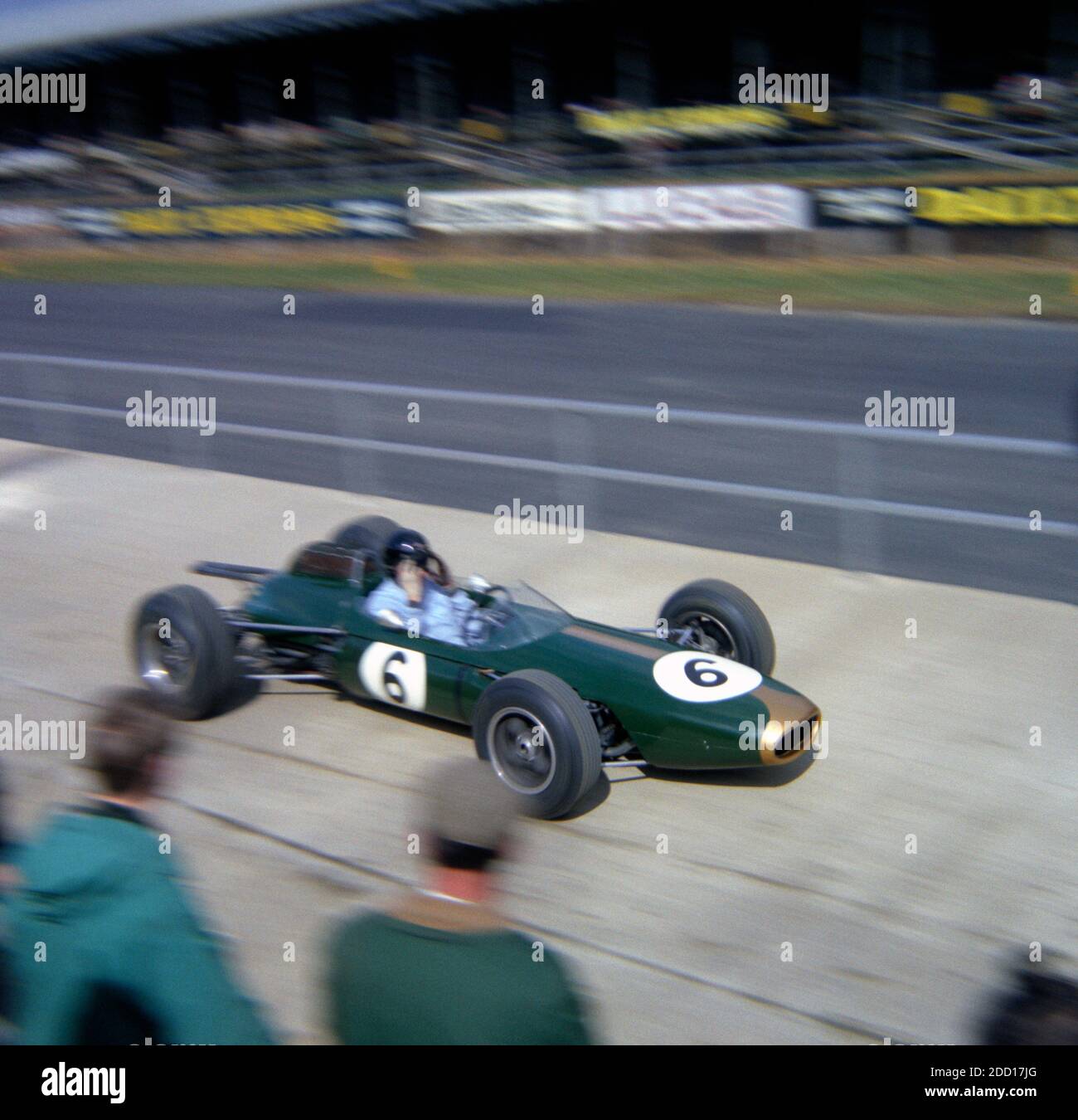 Dan Gurney, Brabham-Climax, descending the pit-road at Silverstone at the start of Practise for the 1964 BRDC International Trophy Race 1st May 1964 Stock Photo