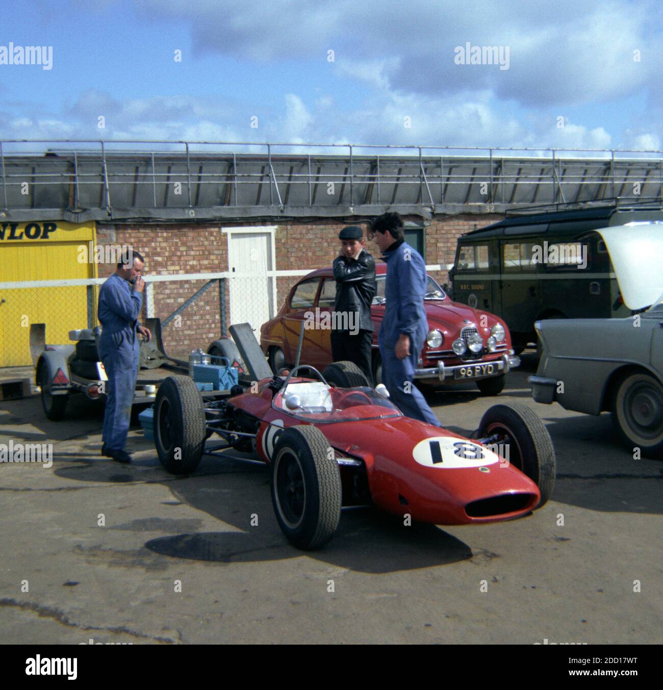Jo Siffert's, Lotus-BRM, with mechanics in the paddock at Silverstone, before Practise for the 1964 BRDC International Trophy Race 1st May 1964 Stock Photo