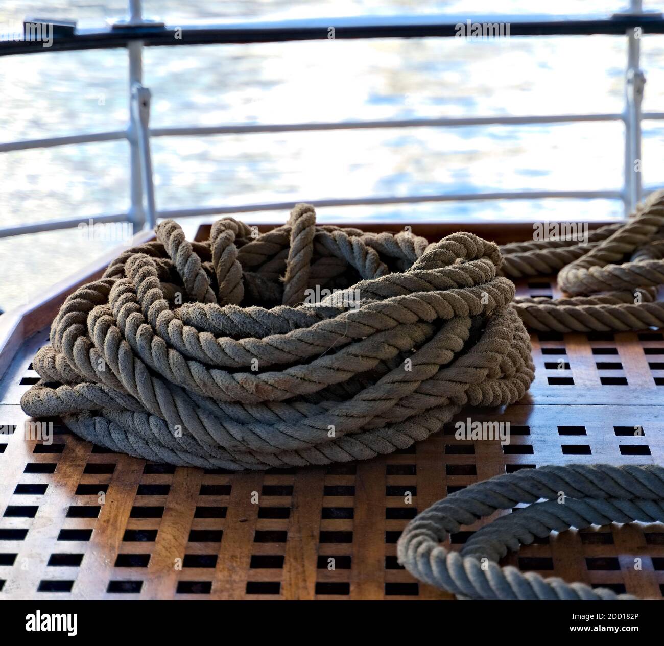 Coiled rope on wooden deck hi-res stock photography and images - Alamy