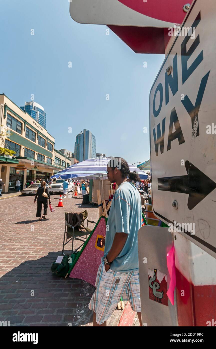 One Way sign and people in scene from Pike Place Market in Belltown in Seattle, Washington. Stock Photo