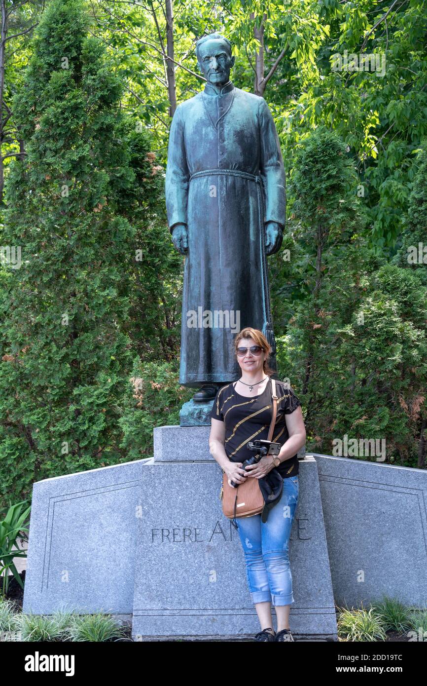 Female tourist portrait by the Brother Andre statue, Montreal, Canada Stock Photo
