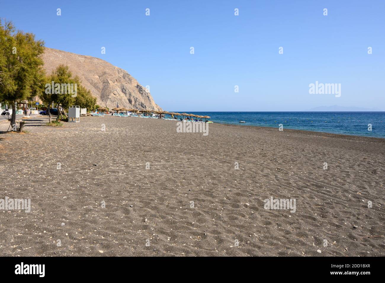 Santorini, Greece - September 17, 2020: View of black sand beach of Perissa on the island of Santorini. Cyclades, Greece Stock Photo