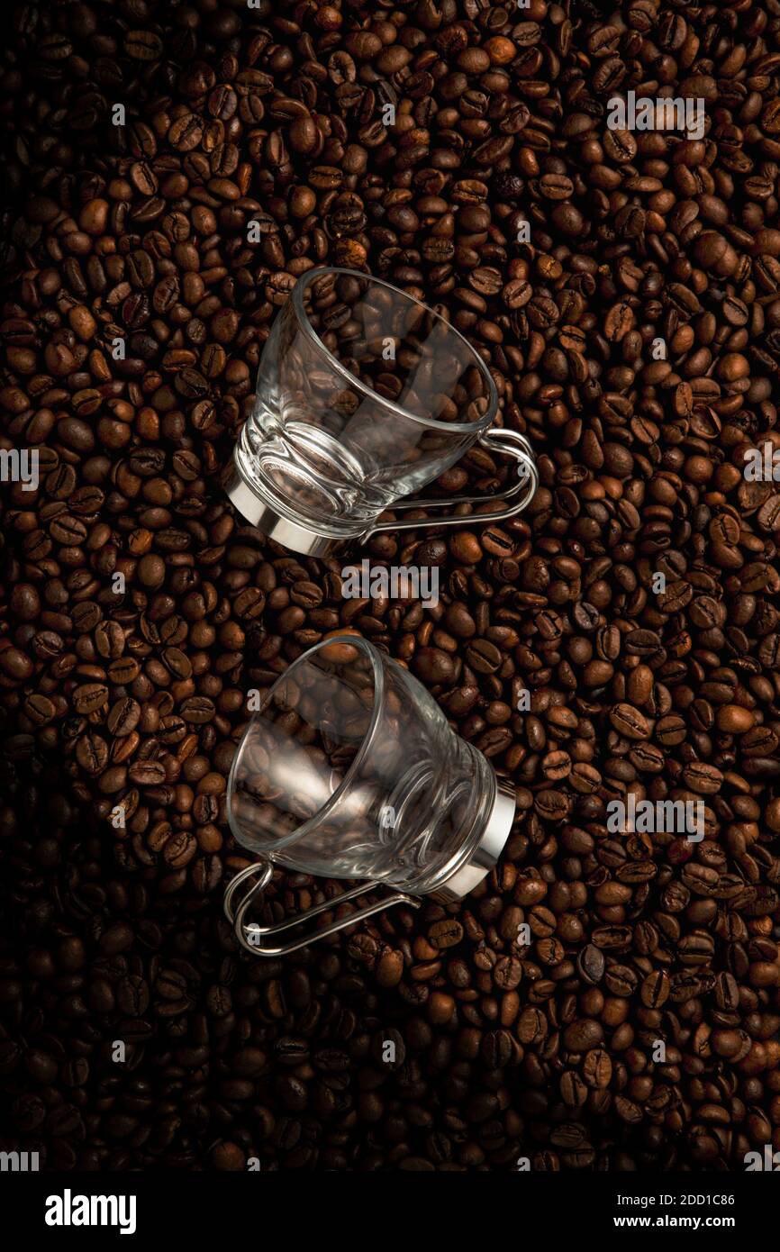 Two Coffee Cups On Top Of Coffee Beans Stock Photo
