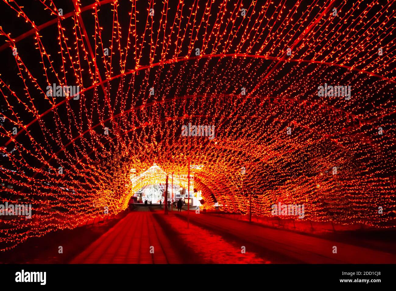 New Year illumination of the city. Tunnel of the glowing Christmas garland. Selective focus Stock Photo