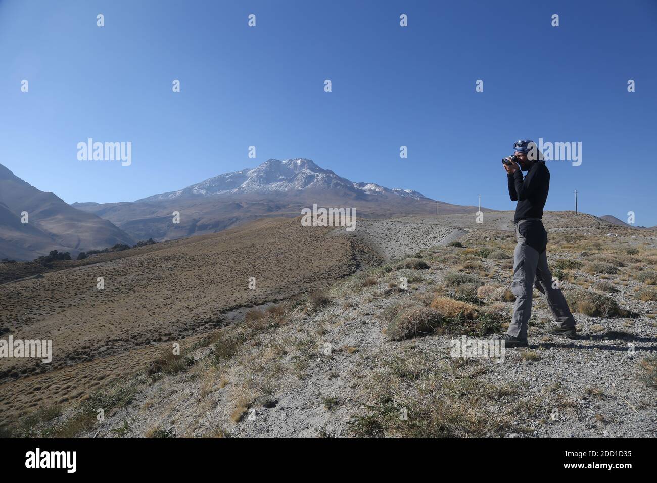 MOUNT SAVALAN, IRAN - SEPTEMBER 27: A photographer take a shot in Mount Savalan (Sabalan) on September 27, 2017 in Savalan, Iran. Savalan is the third highest mountain in Iran. Stock Photo