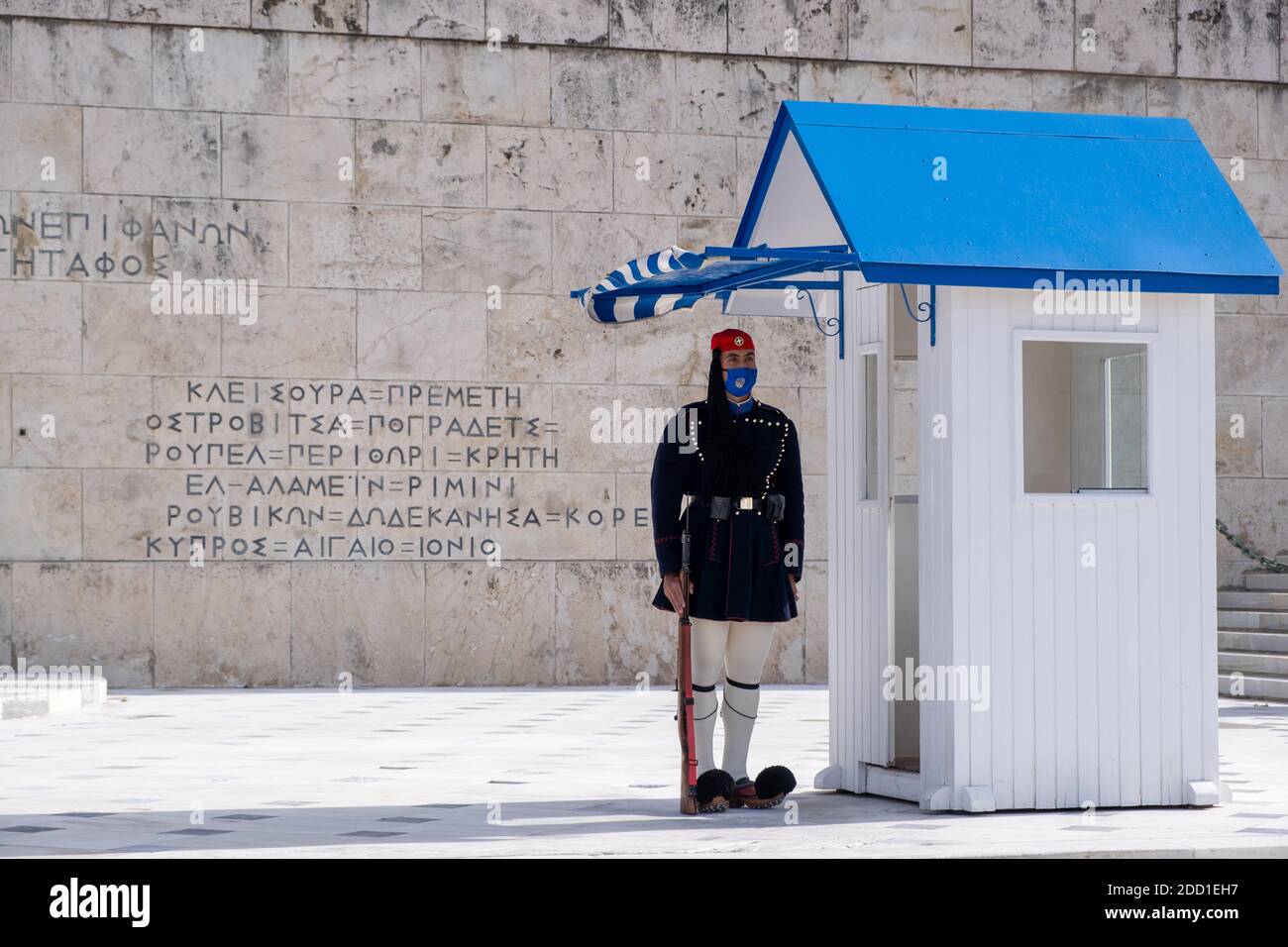 Athens Greece, November 19, 2020. Presidential guard tsolias wearing a COVID 19 protective face mask, standing infront of Greek Parliament building. T Stock Photo