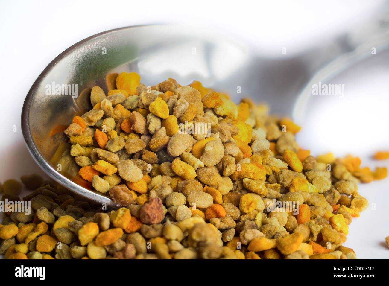 Spoon with healthy bee pollen. Stock Photo